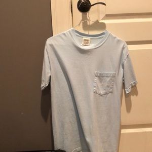 100% cotton. Adult small shirt